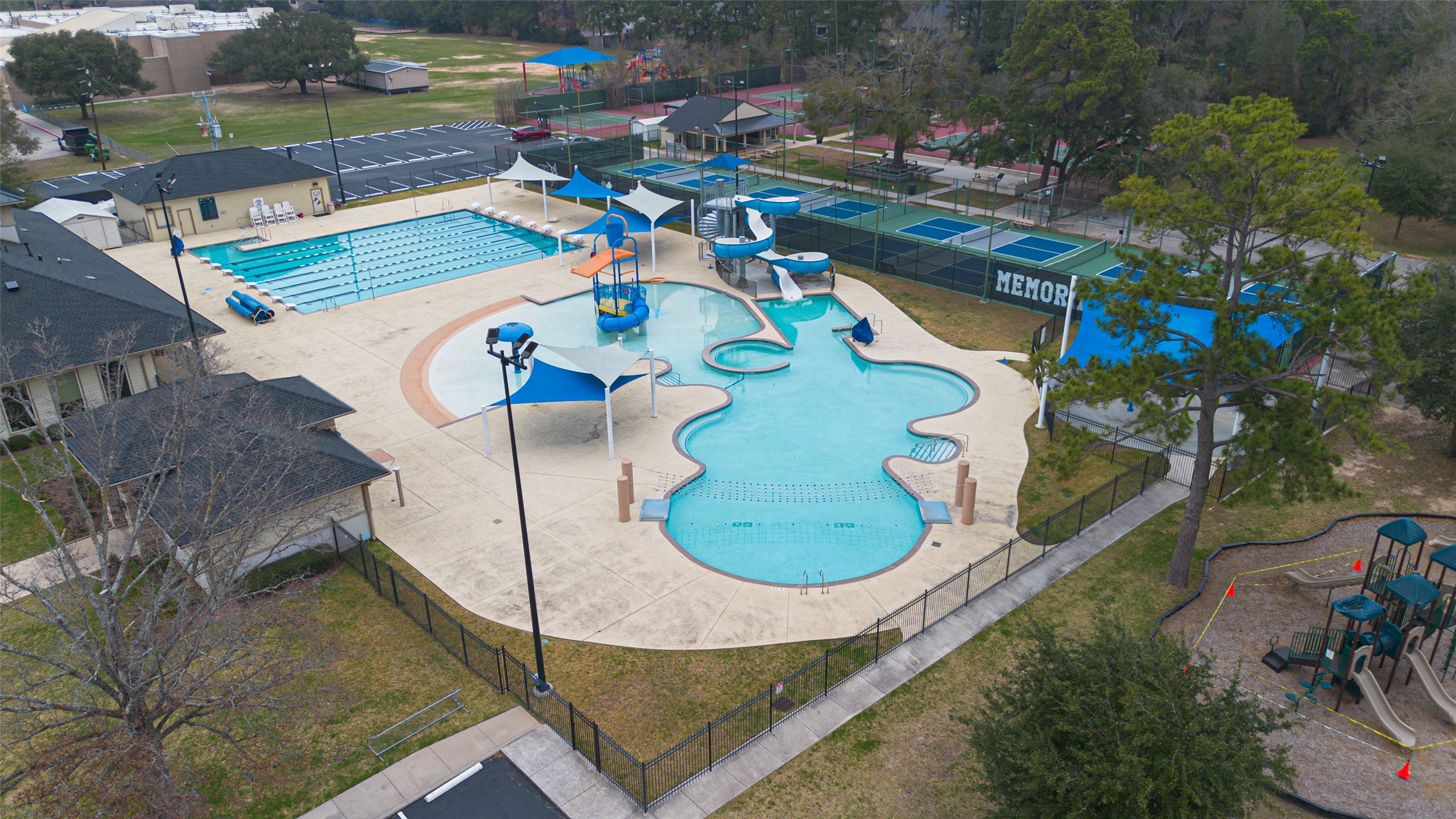 17315 Rothko Lane Spring, TX 77379 - Photo 46 of 50 Resort-style community amenities featuring water slides, a lap swimming pool, a playground, and tennis courts.