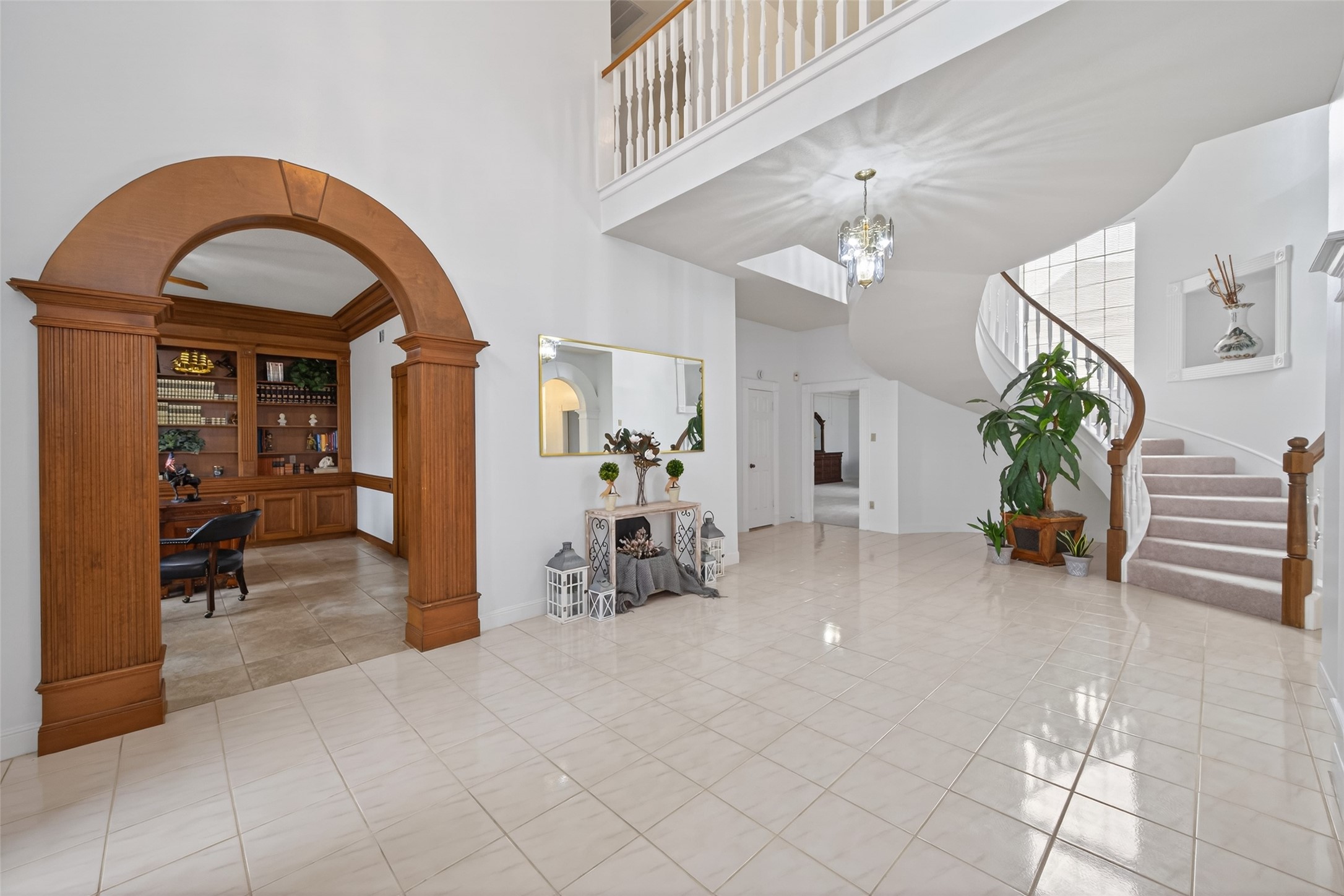 17315 Rothko Lane Spring, TX 77379 - Photo 6 of 50 This elegant entryway features a spacious tile floor, a beautiful wooden archway leading to an office with built-in.