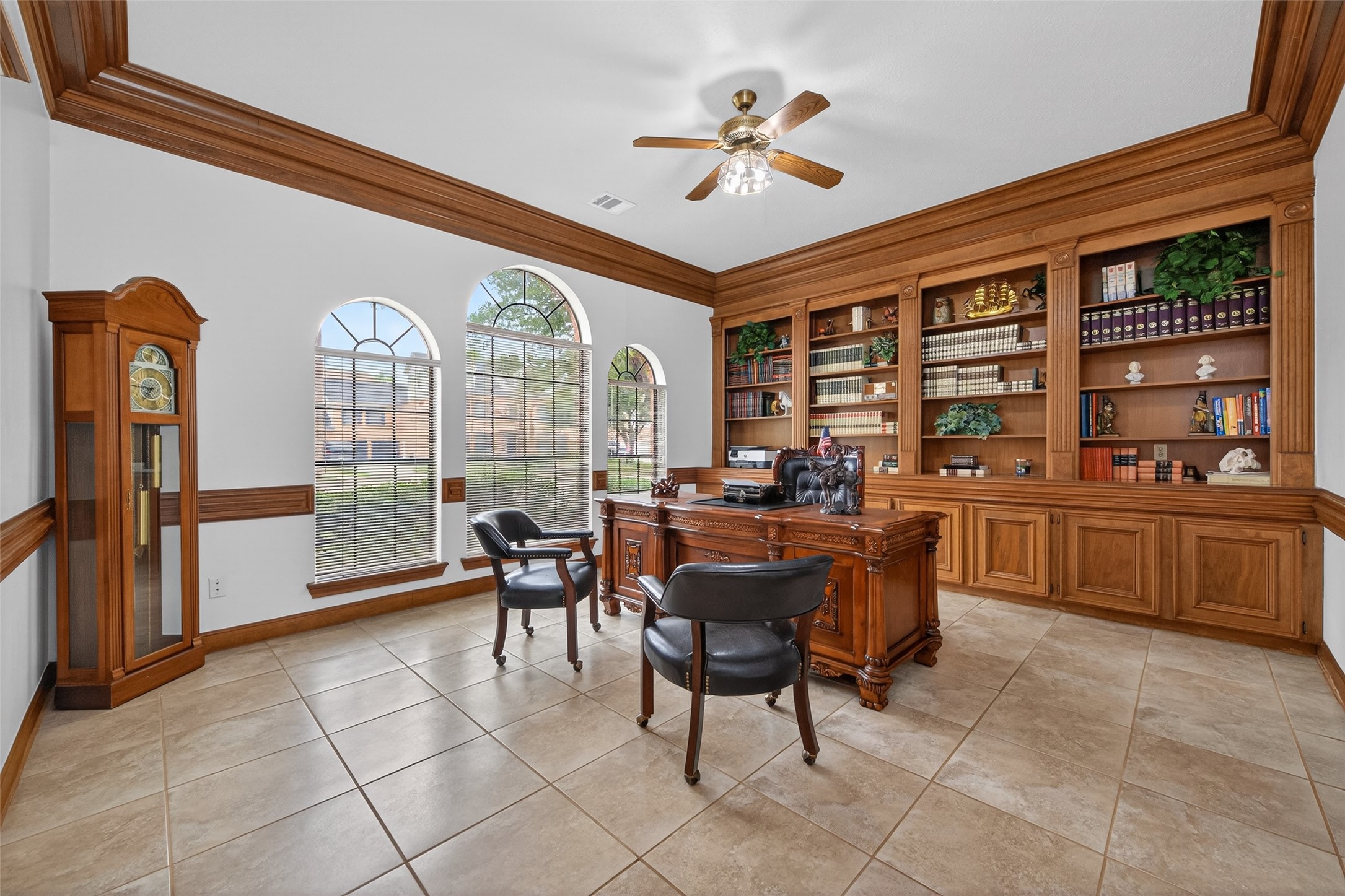 17315 Rothko Lane Spring, TX 77379 - Photo 7 of 50 Elegant study/home office featuring custom built-in wood cabinettry, rich crown molding, and classic architectural details throughtout.