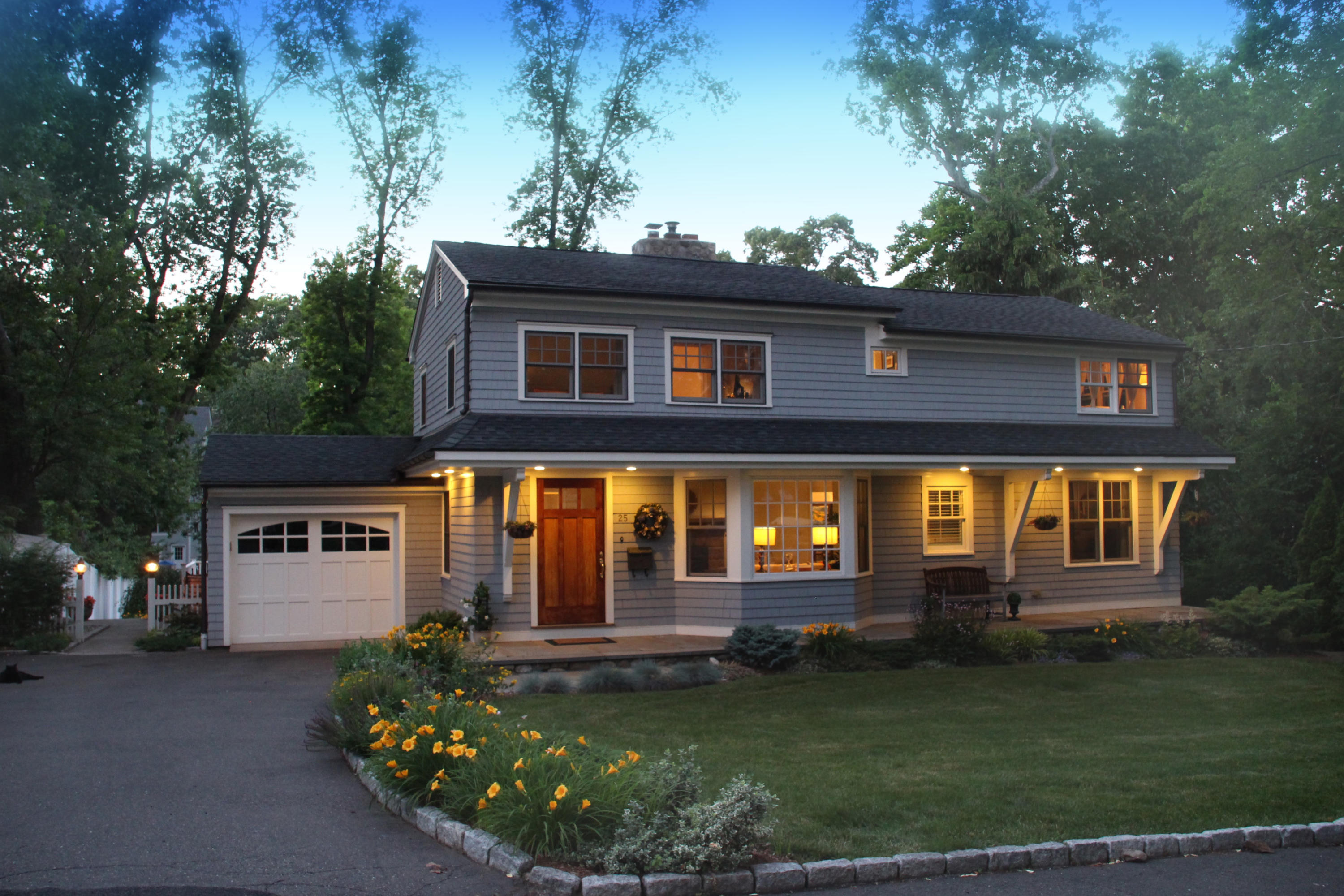 a front view of a house with garden