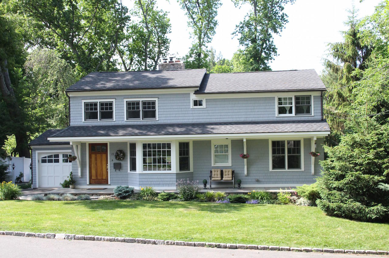 25 Ridgewood Road Norwalk, CT 06853 - Photo 36 of 37 a front view of a house with a yard