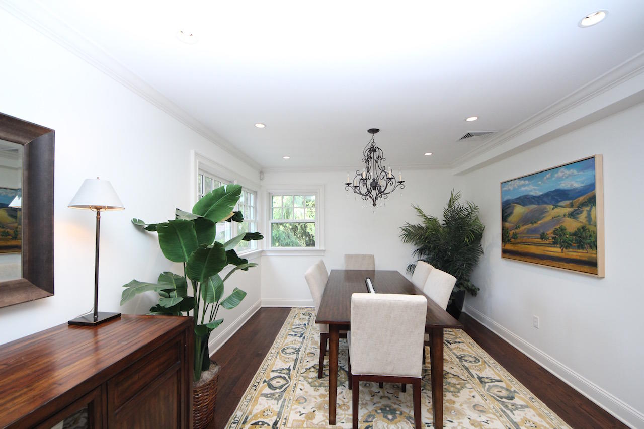 25 Ridgewood Road Norwalk, CT 06853 - Photo 9 of 37 a dining room with furniture and a potted plant