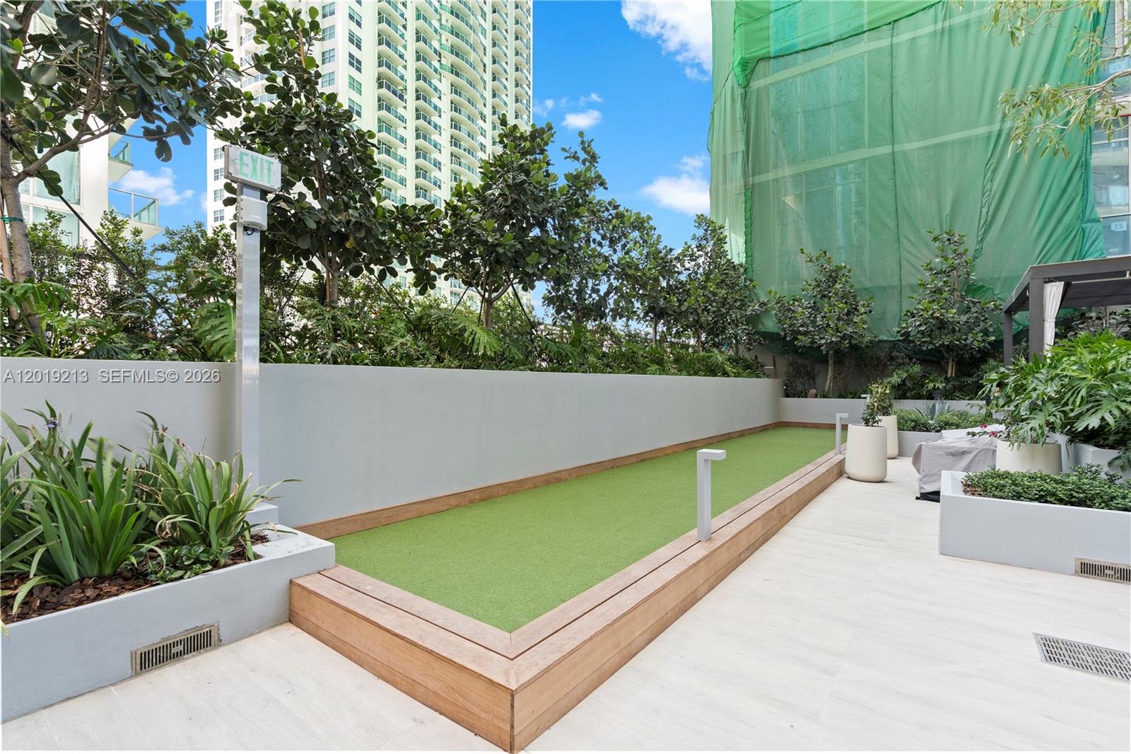 77 Southeast 5th, Unit 3702 Miami, FL 33131 - Photo 39 of 63 a view of a pool with a bench in front of it