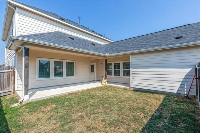 a view of house with backyard