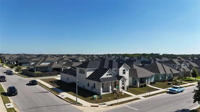a front view of a houses with a city view