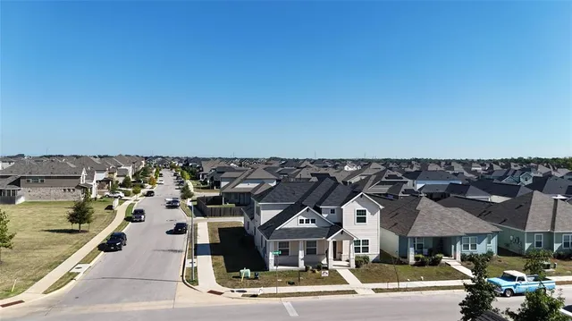 a front view of a building with parking spaces