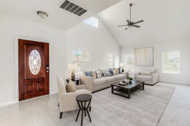 a living room with furniture and a window