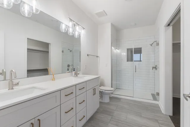 a hallway with wooden floor and entryway