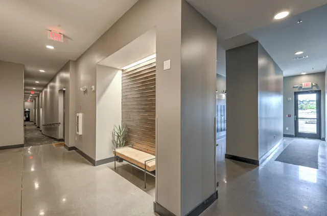 a black and white kitchen with a stove a sink and a microwave