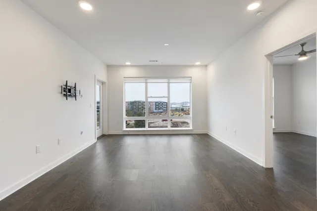a kitchen with appliances a sink and cabinets