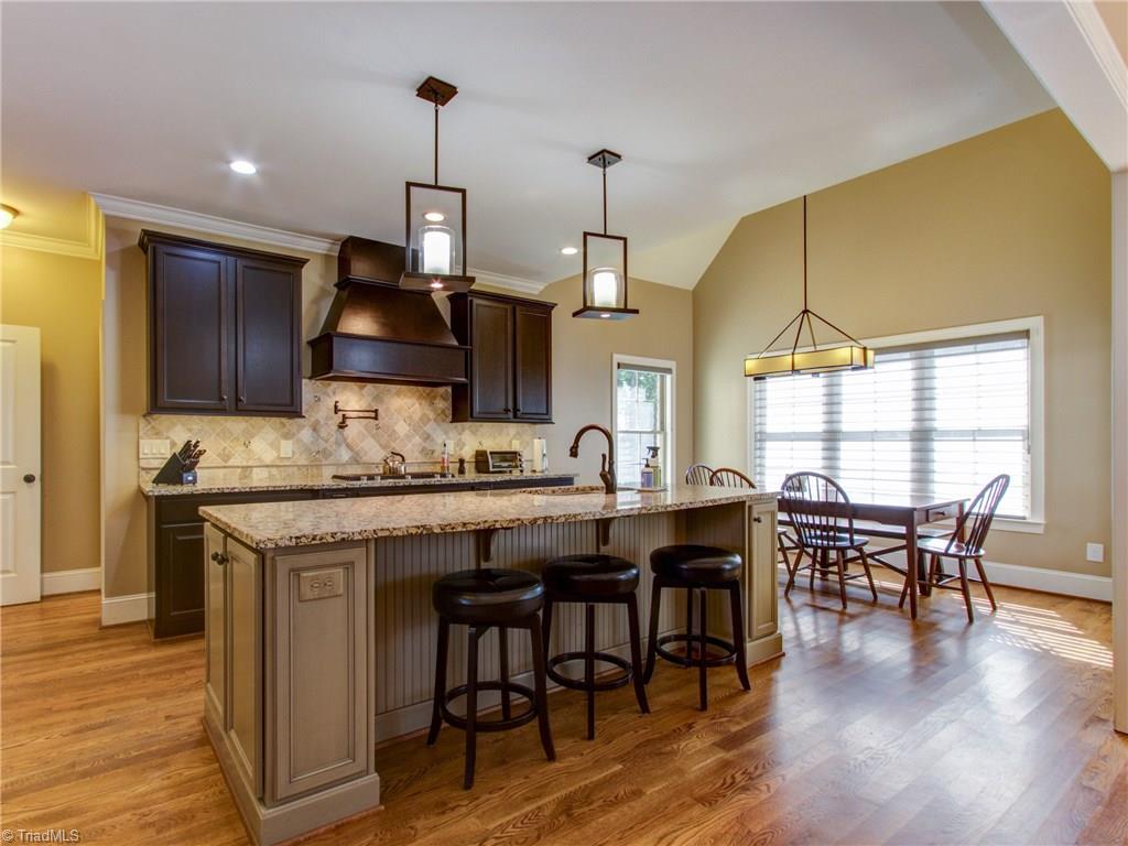 5911 Crutchfield Farm Road Oak Ridge, NC 27310 - Photo 6 of 30 Incredible Kitchen and informal dining. Custom Blinds throughout!