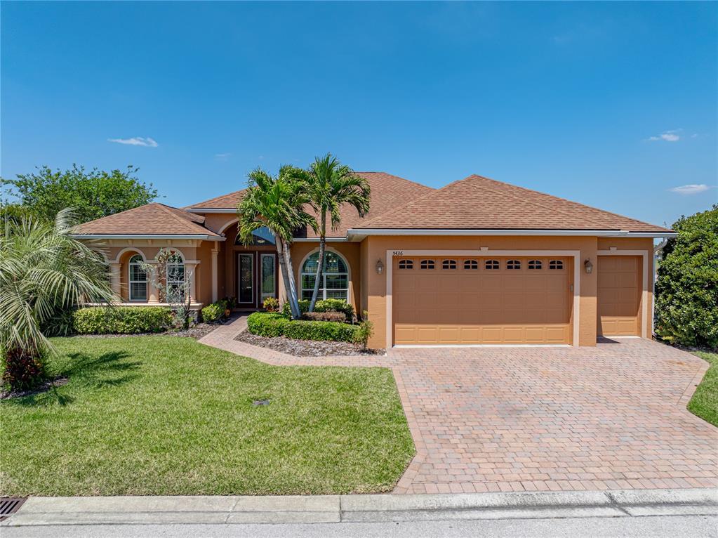a front view of a house with garden and porch