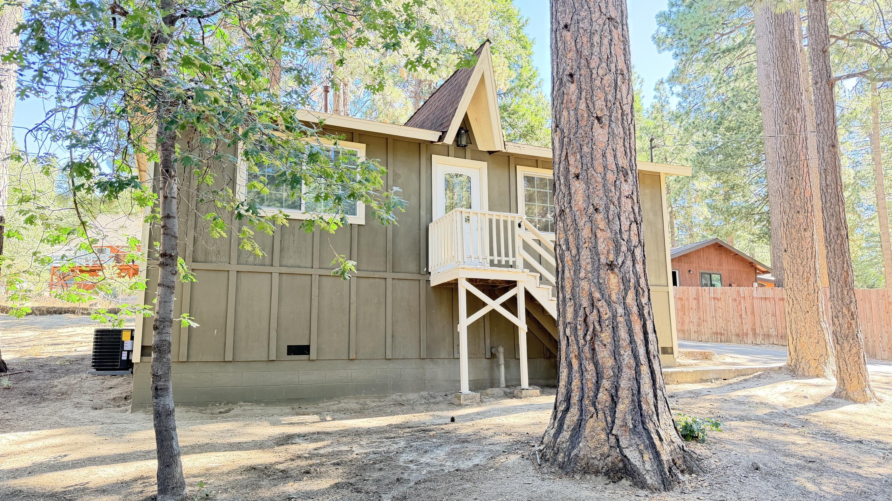 52830 Pine Cove Road Idyllwild, CA 92549 - Photo 2 of 19 a front view of a house with a tree