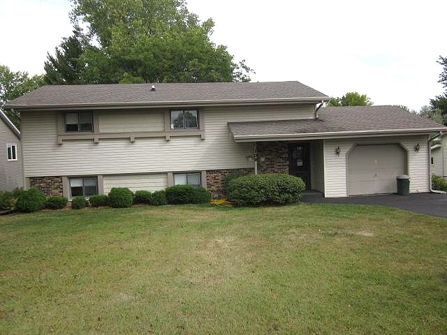 106 Newport Road Lake Summerset, IL 61019 - Photo 1 of 17 a front view of a house with a garden