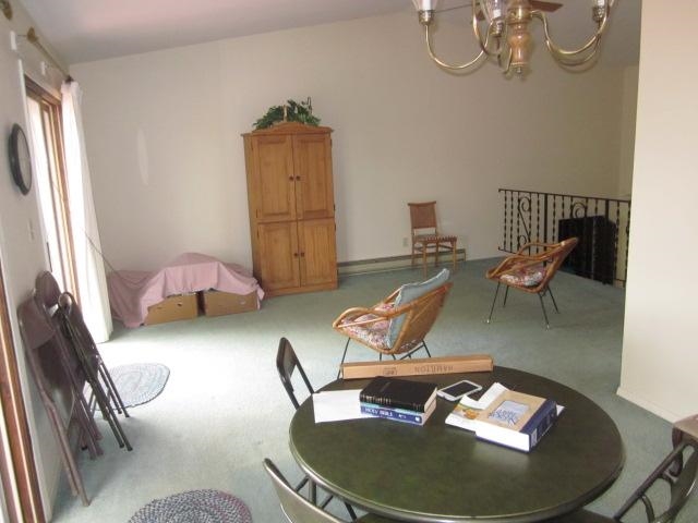 106 Newport Road Lake Summerset, IL 61019 - Photo 5 of 17 a living room with furniture and a chandelier