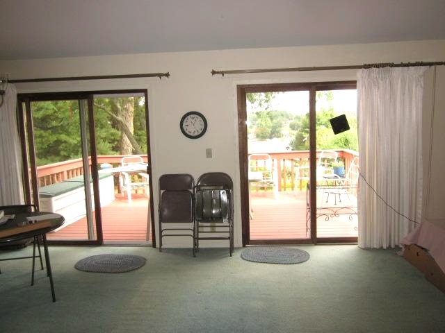106 Newport Road Lake Summerset, IL 61019 - Photo 7 of 17 a living room with furniture and a large window