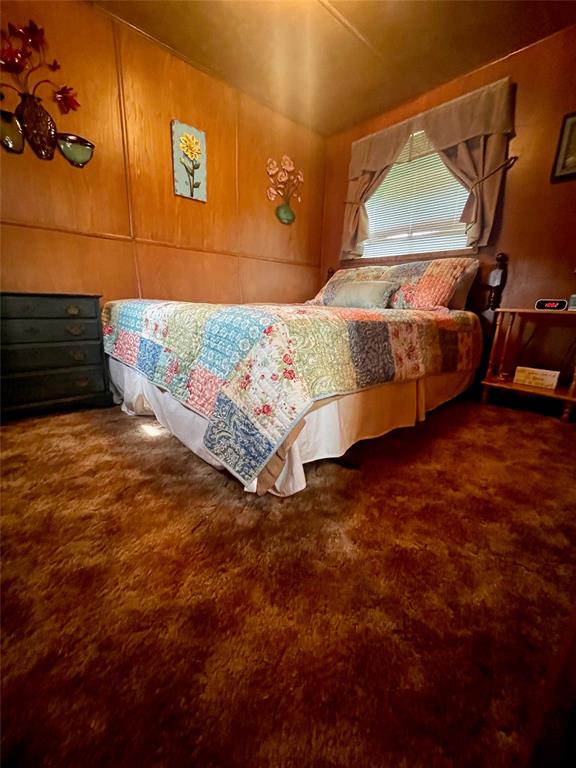 641 Sky Camp Loop, Unit 2 Graford, TX 76449 - Photo 16 of 29 a bedroom with a bed and window