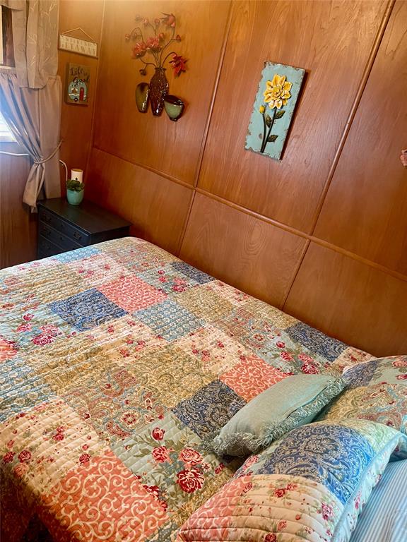 641 Sky Camp Loop, Unit 2 Graford, TX 76449 - Photo 17 of 29 a bedroom with a bed