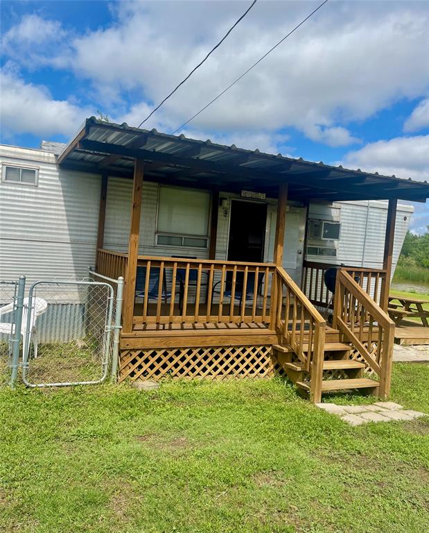 641 Sky Camp Loop, Unit 2 Graford, TX 76449 - Photo 2 of 29 a view of a house with a wooden deck