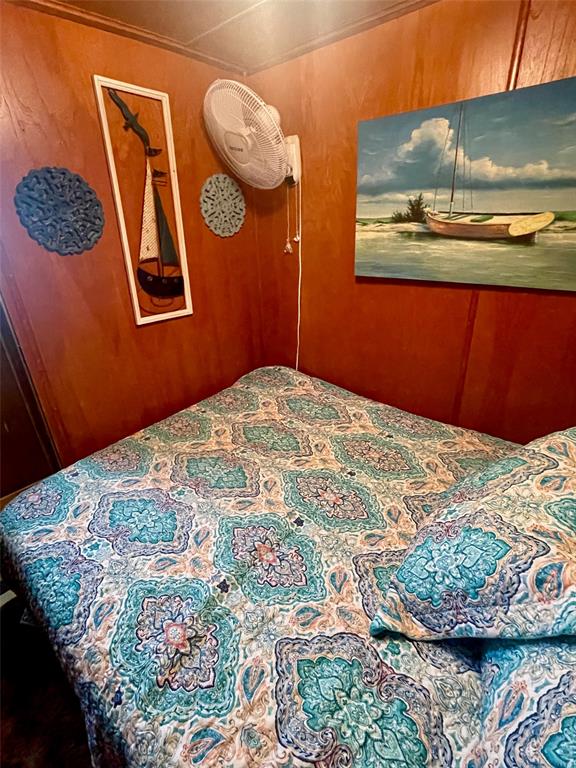 641 Sky Camp Loop, Unit 2 Graford, TX 76449 - Photo 22 of 29 a bedroom with a bed and painting on the wall