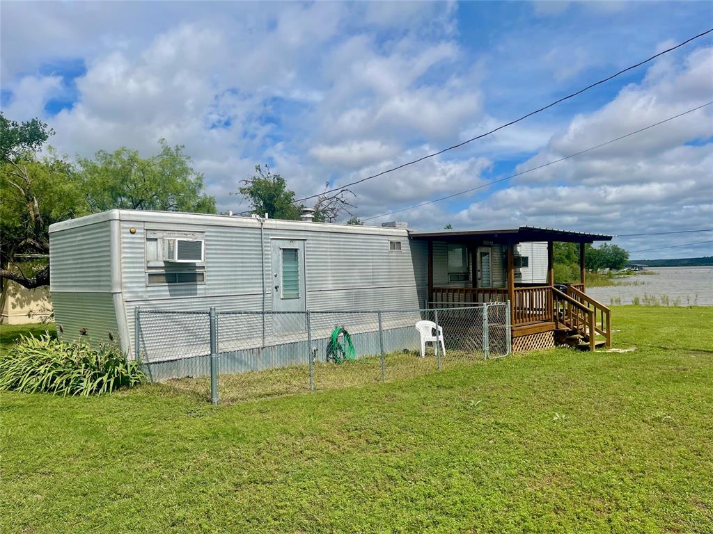 641 Sky Camp Loop, Unit 2 Graford, TX 76449 - Photo 3 of 29 a view of house with backyard and garden