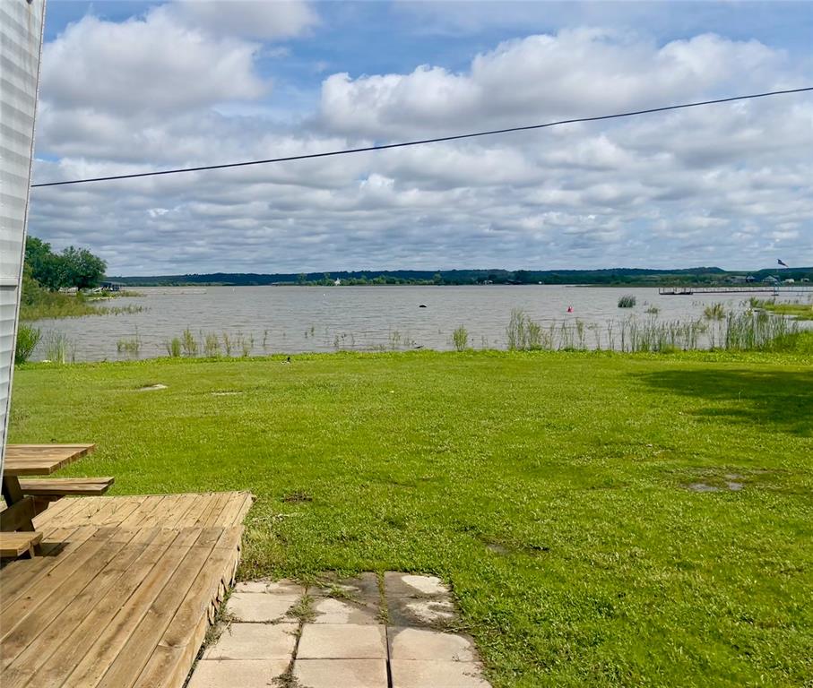 641 Sky Camp Loop, Unit 2 Graford, TX 76449 - Photo 4 of 29 a view of a water pond with an outdoor space