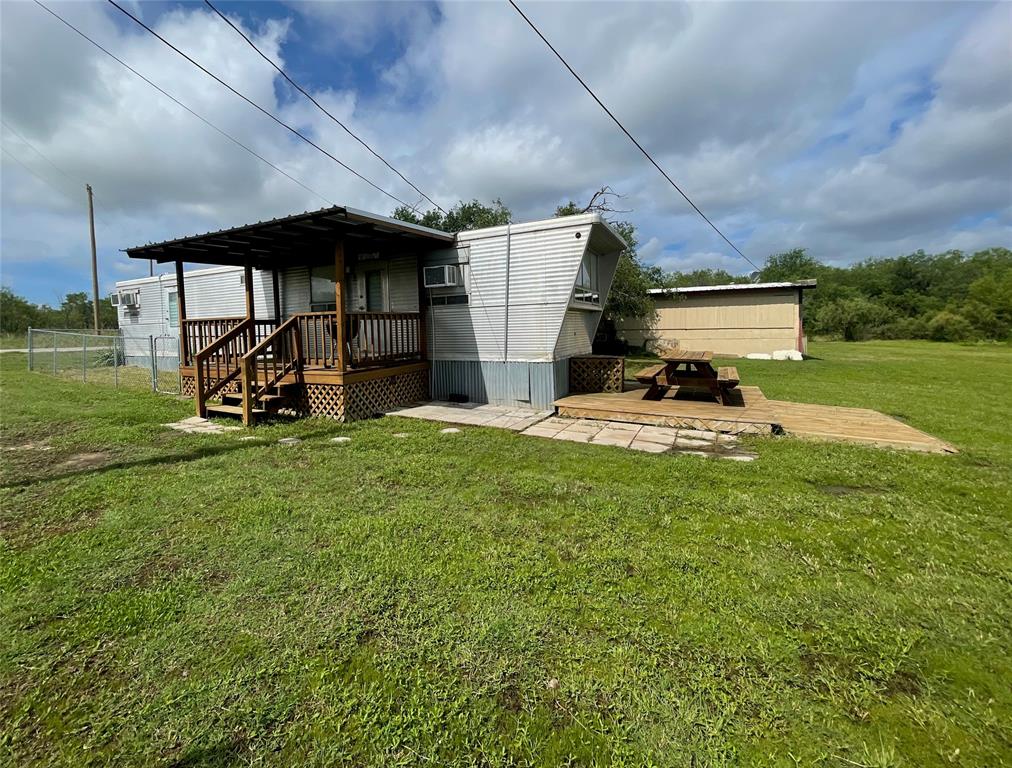 641 Sky Camp Loop, Unit 2 Graford, TX 76449 - Photo 5 of 29 a view of a backyard with a sitting area and slide