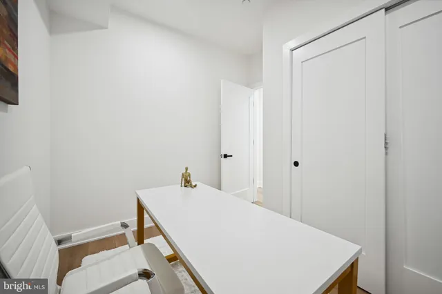 a room with a table and chairs