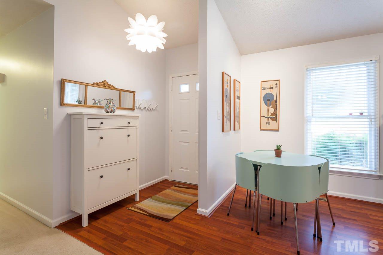2013 Broadingham Court Raleigh, NC 27615 - Photo 8 of 21 a bedroom with a bed and a desk