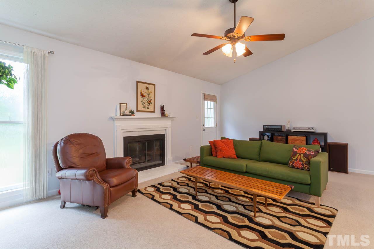 2013 Broadingham Court Raleigh, NC 27615 - Photo 10 of 21 a living room with furniture and a fireplace