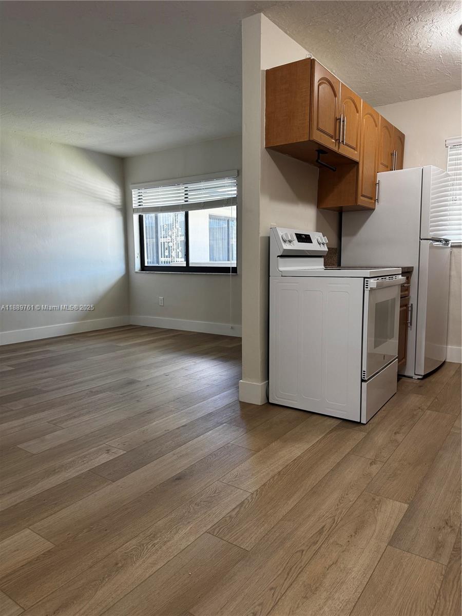 1330 West 29th Street, Unit 30 Hialeah, FL 33012 - Photo 3 of 13 a view of kitchen and living room