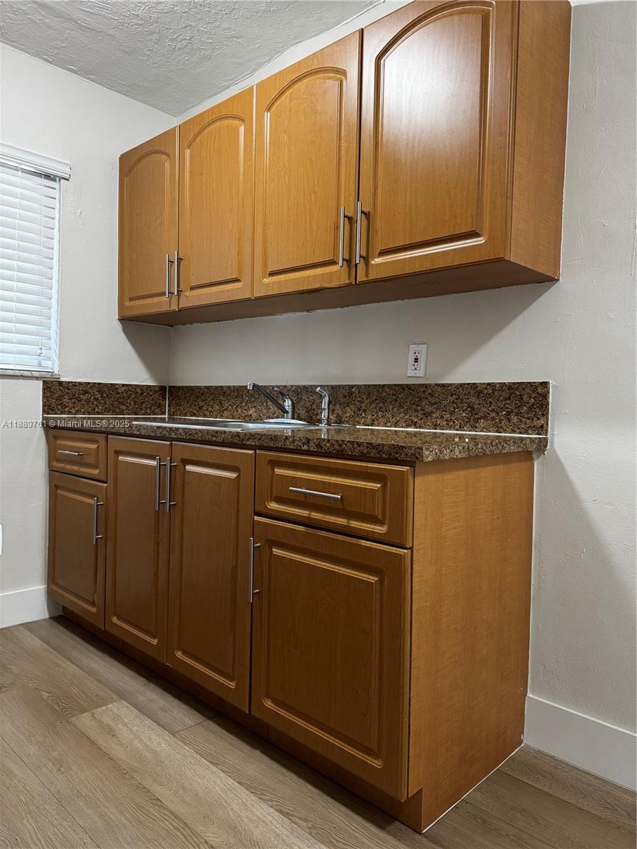 1330 West 29th Street, Unit 30 Hialeah, FL 33012 - Photo 5 of 13 a stove top oven sitting inside of a kitchen