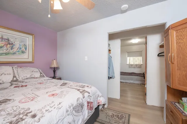 a bedroom with a bed and a view of bathroom