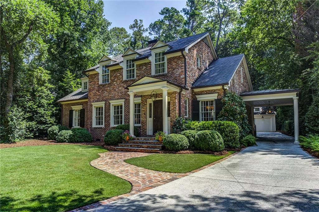 2421 Oldfield Road Northwest Atlanta, GA 30327 - Photo 1 of 1 Gorgeous Facade with Old World Brick, Copper Gutters And RoofingPorte Cochere, Aggregate Driveway Leading to Large Two Car Garage with Plenty of Room for Storage