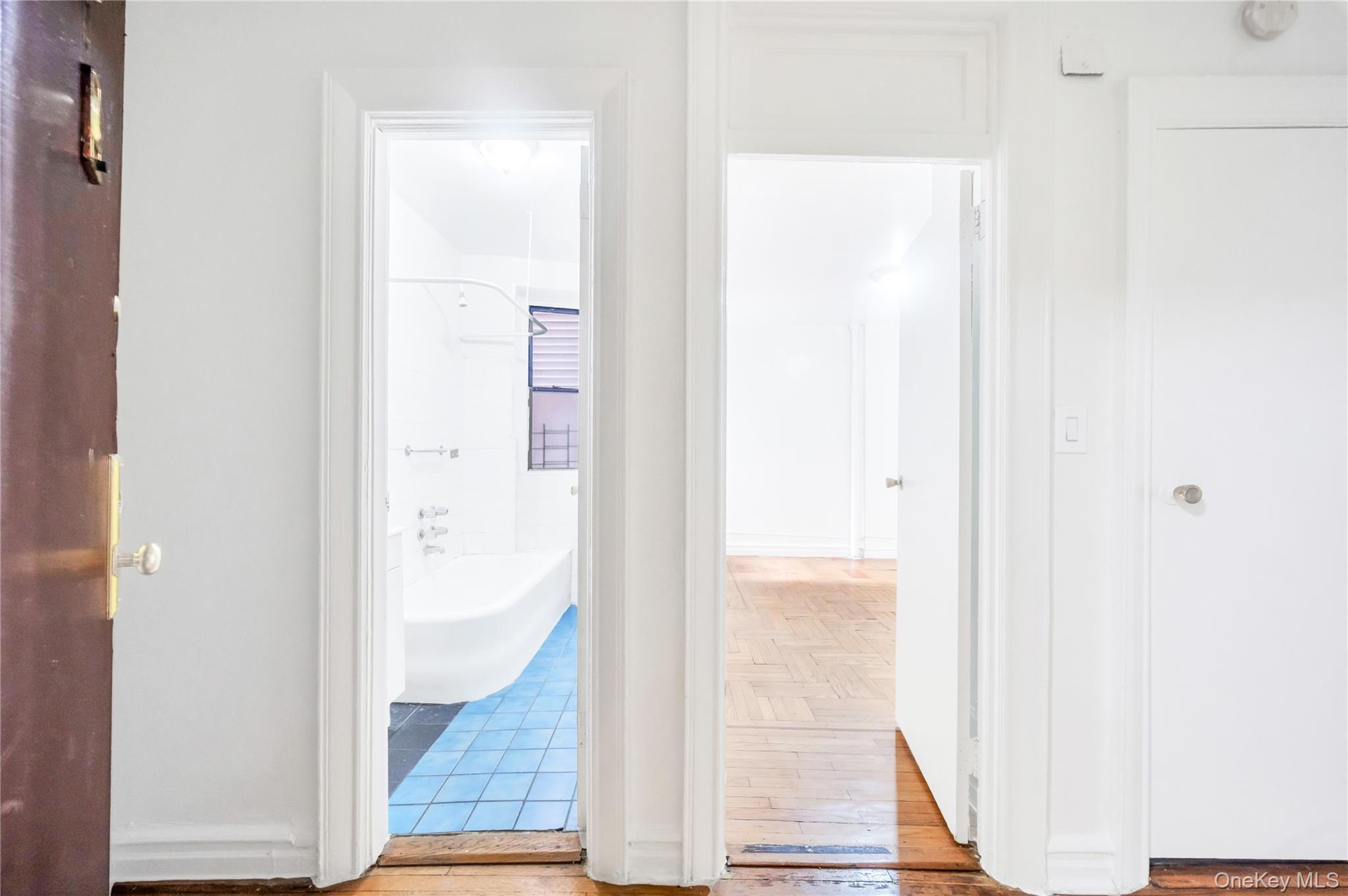 3152 Hull Avenue Bronx, NY 10467 - Photo 13 of 35 a view of a hallway with wooden floor and staircase