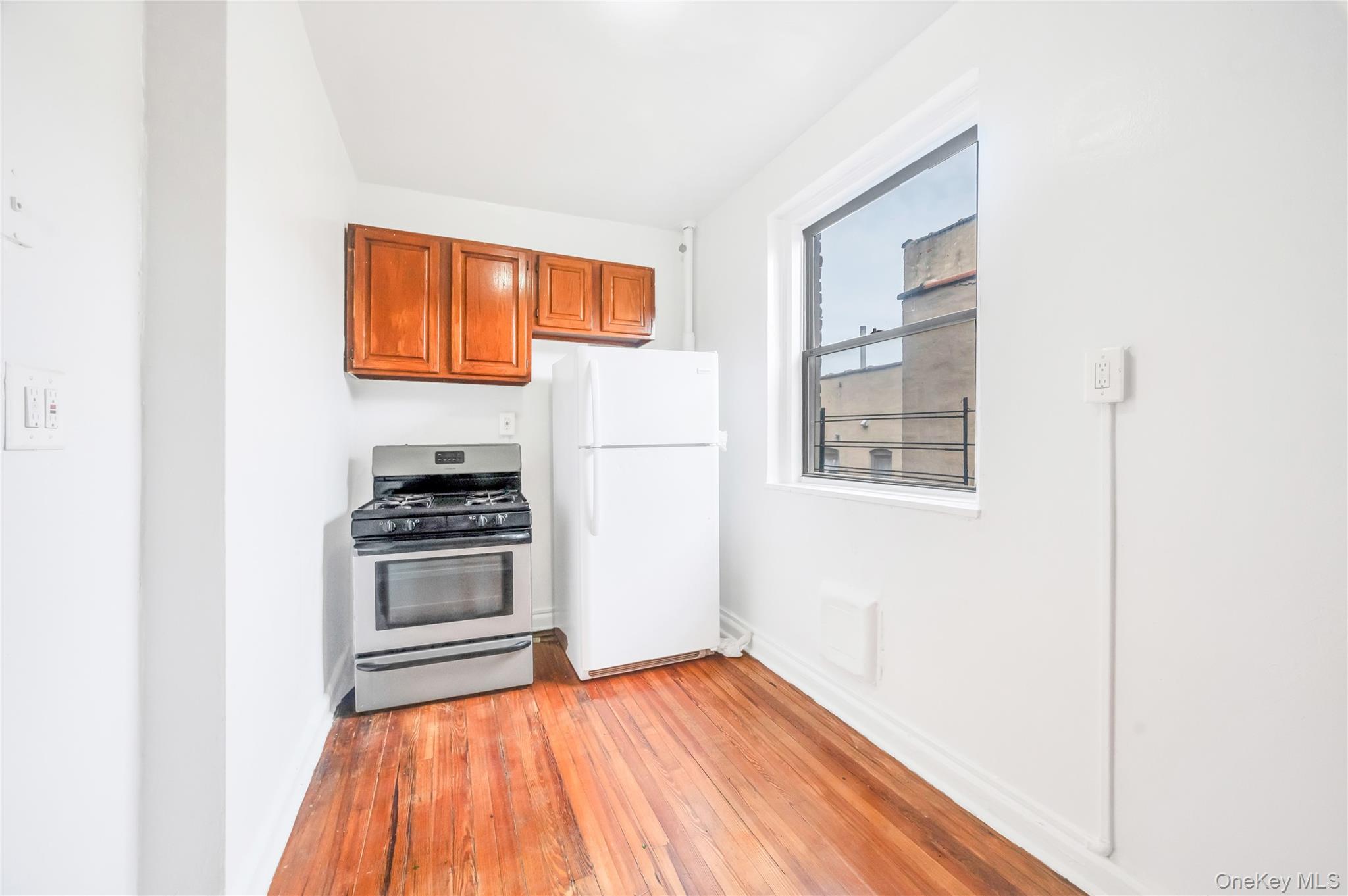 3152 Hull Avenue Bronx, NY 10467 - Photo 21 of 35 a kitchen with stainless steel appliances a refrigerator and a stove top oven