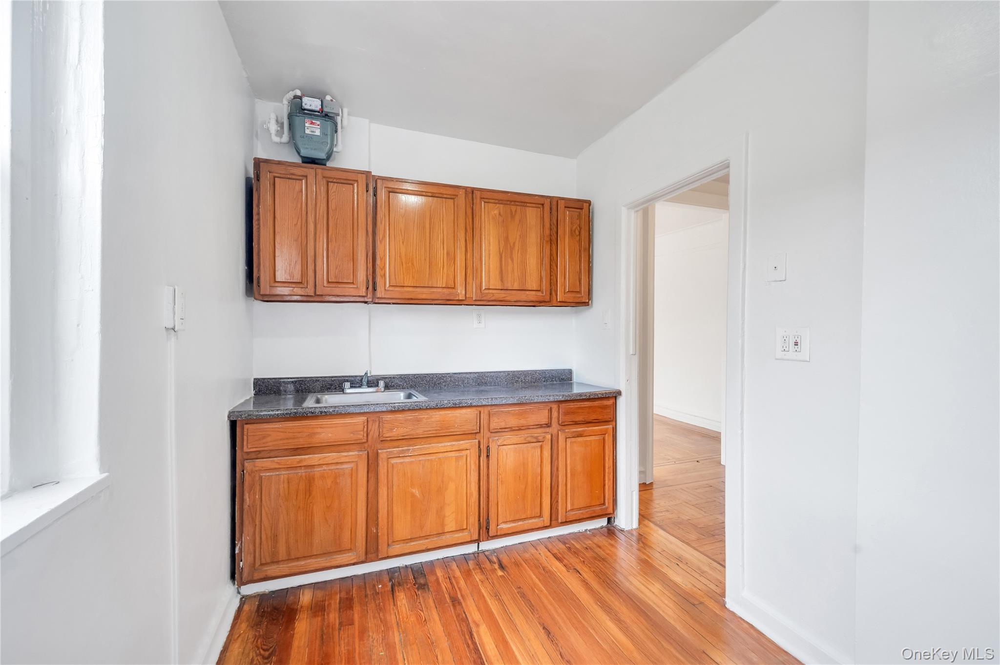 3152 Hull Avenue Bronx, NY 10467 - Photo 22 of 35 a view of a room with wooden floor and cabinet