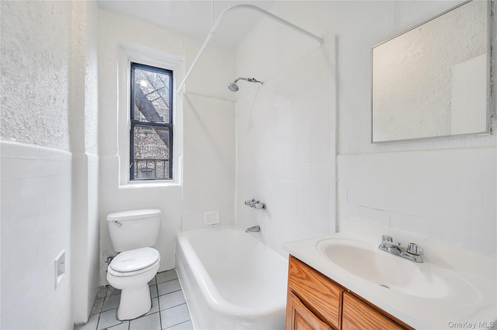3152 Hull Avenue Bronx, NY 10467 - Photo 26 of 35 a bathroom with a sink toilet and shower