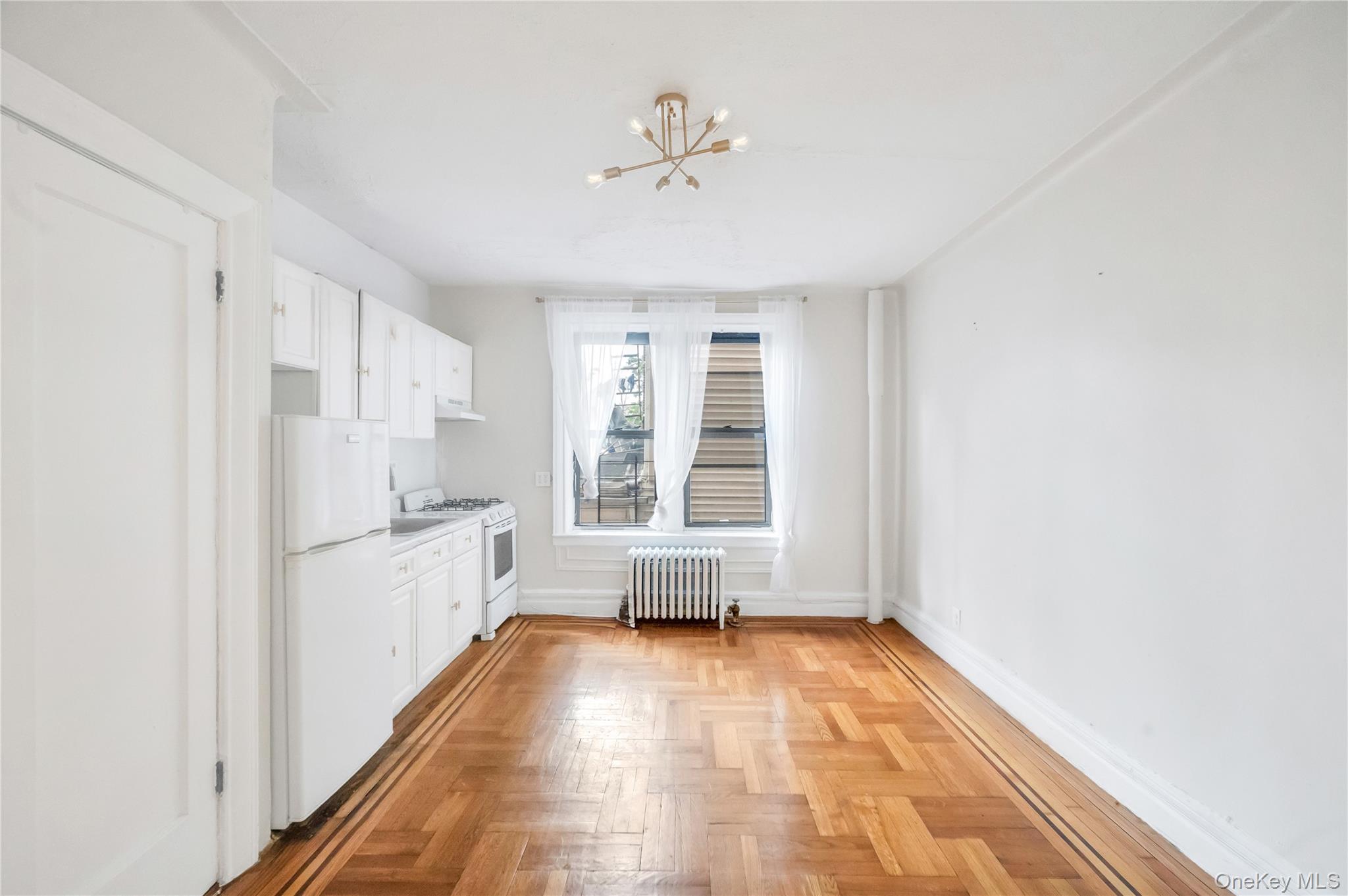 3152 Hull Avenue Bronx, NY 10467 - Photo 27 of 35 a view of an empty room with a window