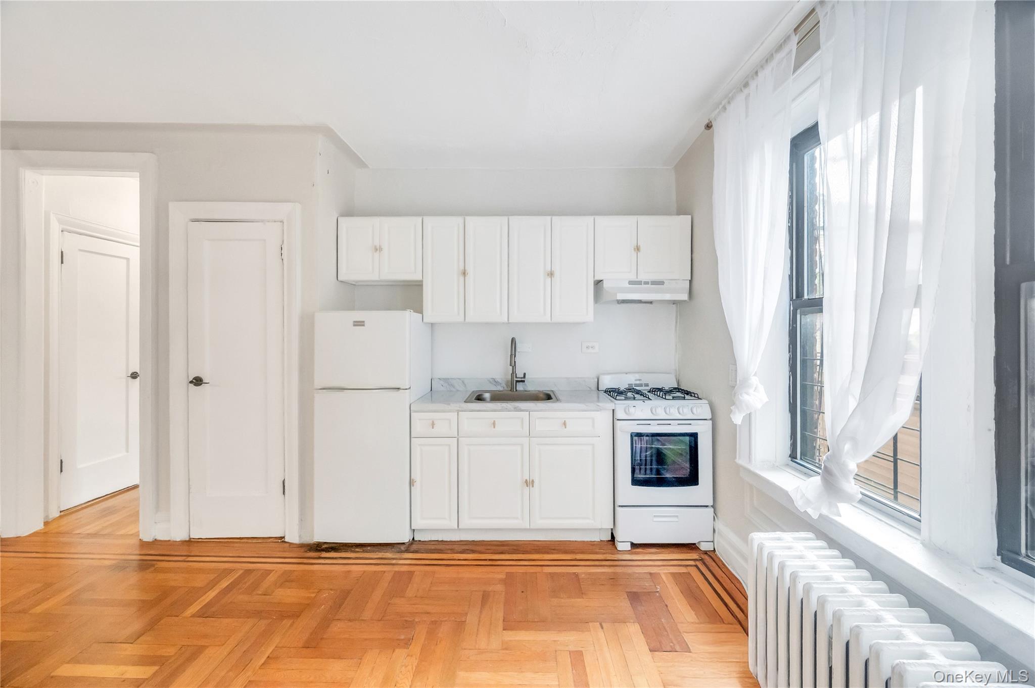 3152 Hull Avenue Bronx, NY 10467 - Photo 28 of 35 a kitchen with stainless steel appliances granite countertop a stove and a refrigerator