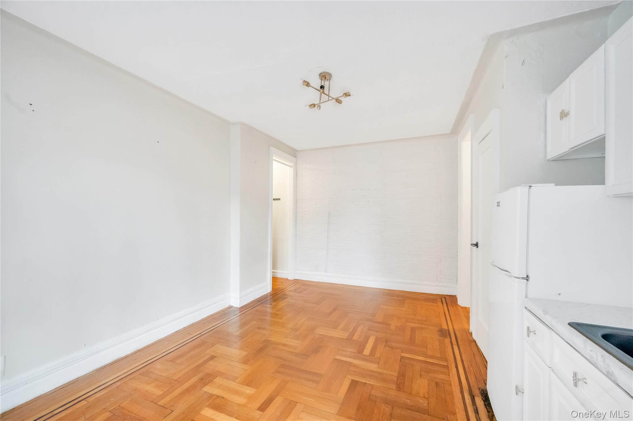 3152 Hull Avenue Bronx, NY 10467 - Photo 29 of 35 a view of a kitchen with a sink dishwasher refrigerator stove and a window