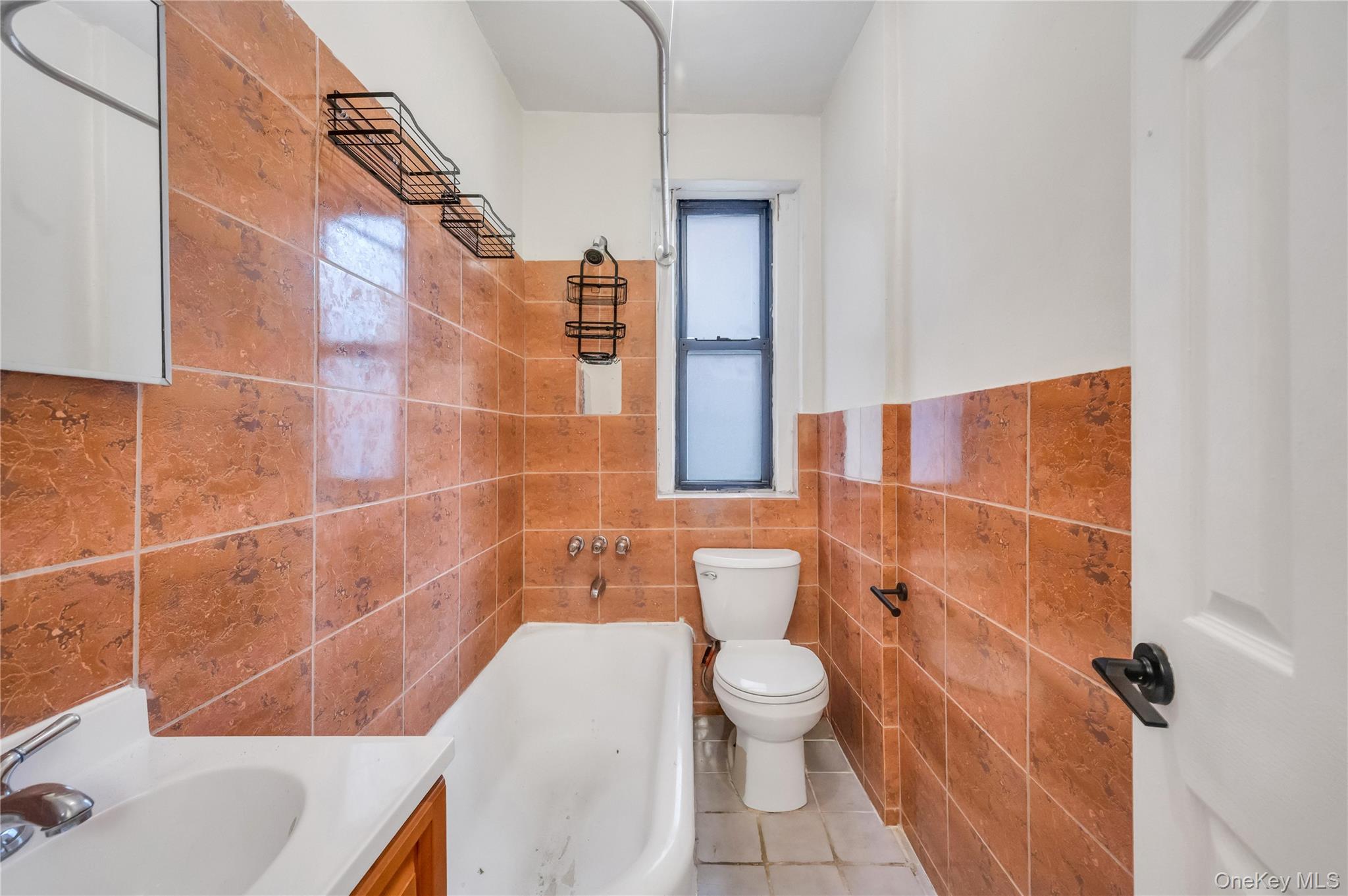 3152 Hull Avenue Bronx, NY 10467 - Photo 32 of 35 a bathroom with a sink and toilet