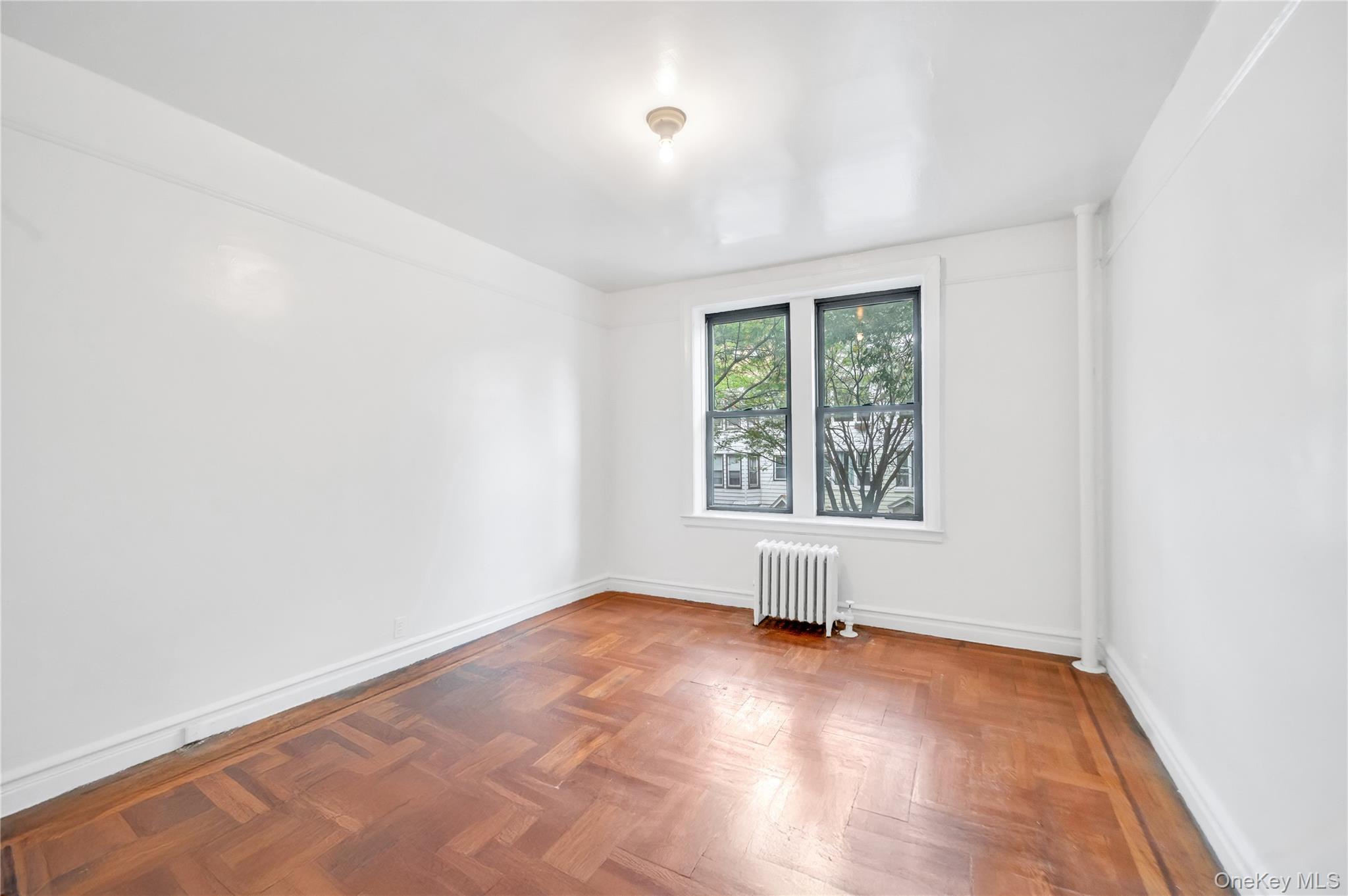 3152 Hull Avenue Bronx, NY 10467 - Photo 10 of 35 an empty room with a window