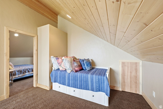 5404 Mountain View Road Coalville, UT 84017 - Photo 25 of 50 Sloping wood-paneled ceiling, wall-to-wall carpeting, and wood trim details