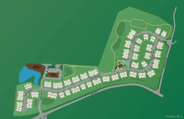 a green field with lots of tress in it