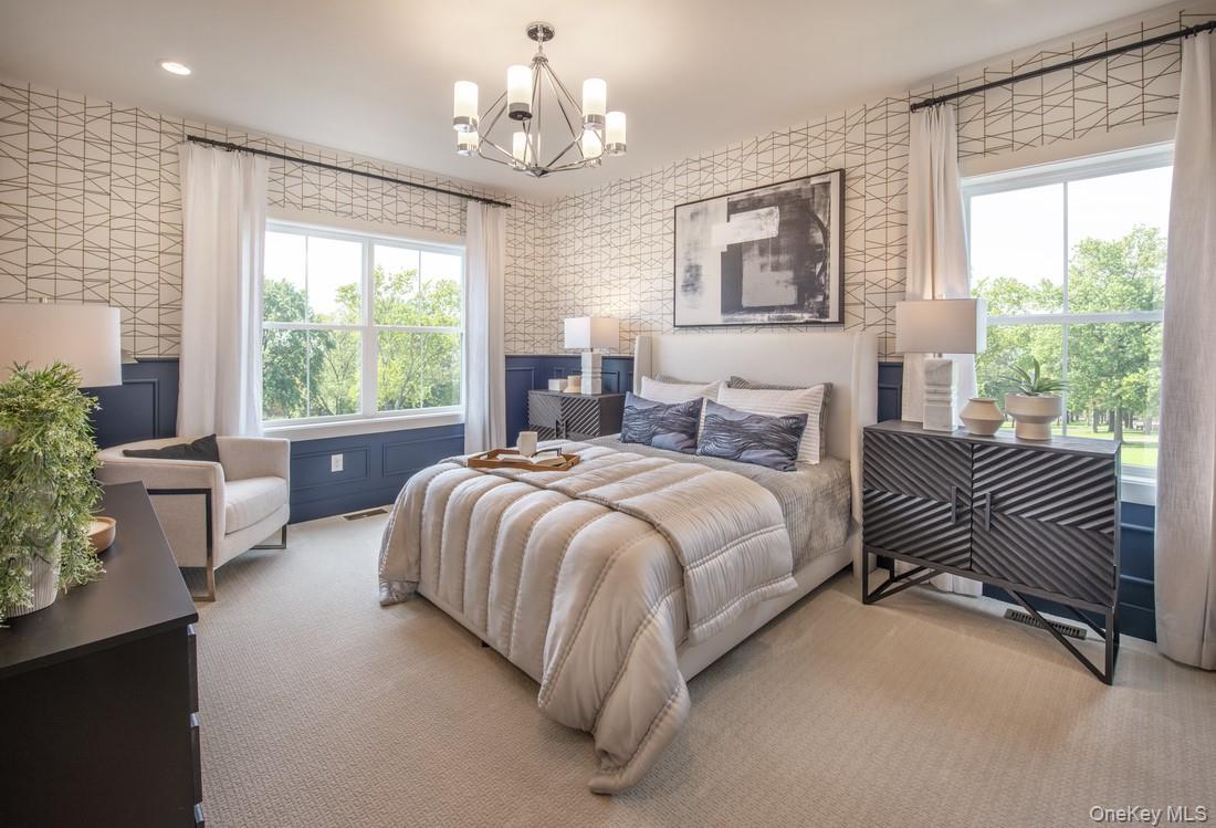 5 Fieldstone Knoll, Unit 45 Armonk, NY 10504 - Photo 8 of 17 a spacious bedroom with a bed and a chandelier