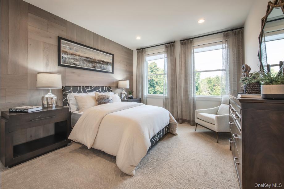 5 Fieldstone Knoll, Unit 45 Armonk, NY 10504 - Photo 10 of 17 a bedroom with a large bed and windows