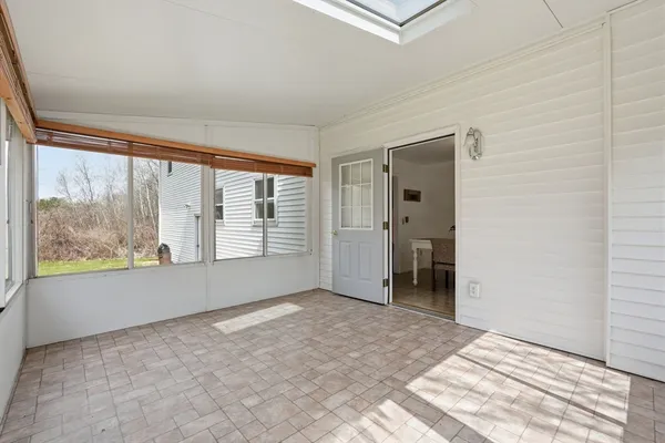 a view of an empty room with a window