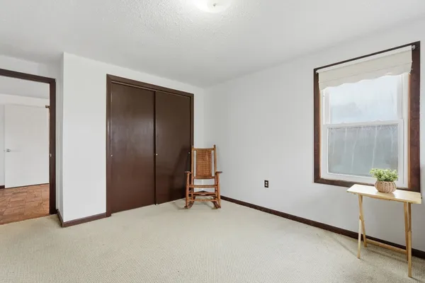 a view of room with furniture and window