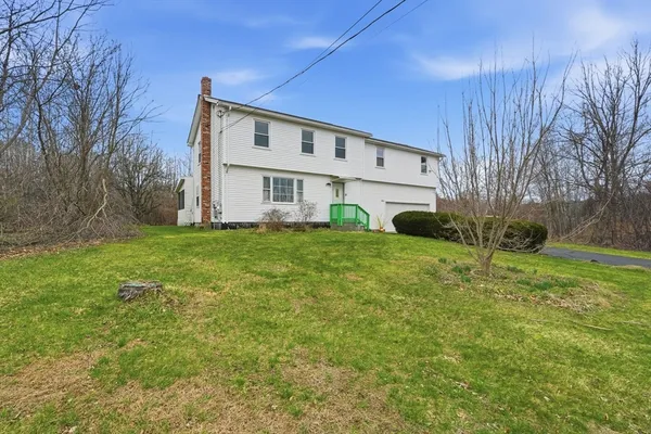 a view of a house with a yard
